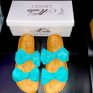 New in box woman’s sandals size 9sandal.  Turquoise like in color. New in box